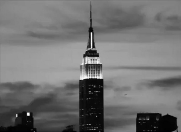 A screen shot from the 1964 movie, Empire, by artist, Andy Warhol, that also functions as a link to the film