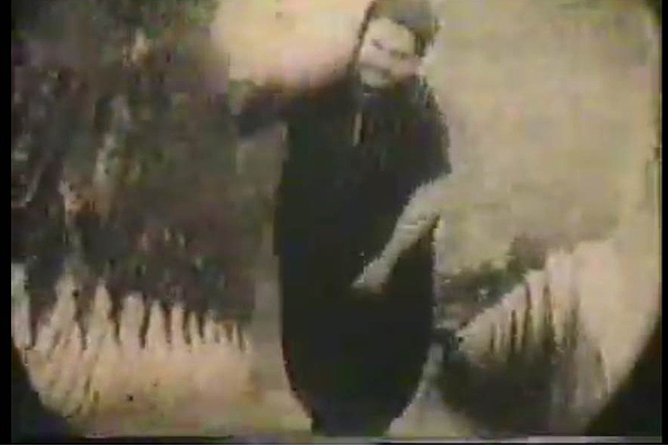 A screen shot from the 1924 movie, Ballet Mecanique, by artist, Fernand Leger, that also functions as a link to the film