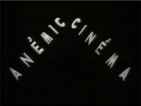 A screen shot from the 1926 movie,Anemikc Cinema, by artist, Marcel Duchamp, that also functions as a link to the film