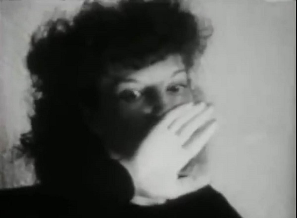 A screen shot from the 1943 movie, Meshes in the Afternoon, by artist, Maya Deren and Alexander Hammid, that also functions as a link to the film
