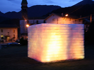 Image from a performance of a video projected on large block of ice by Stephen Kaltenbach
