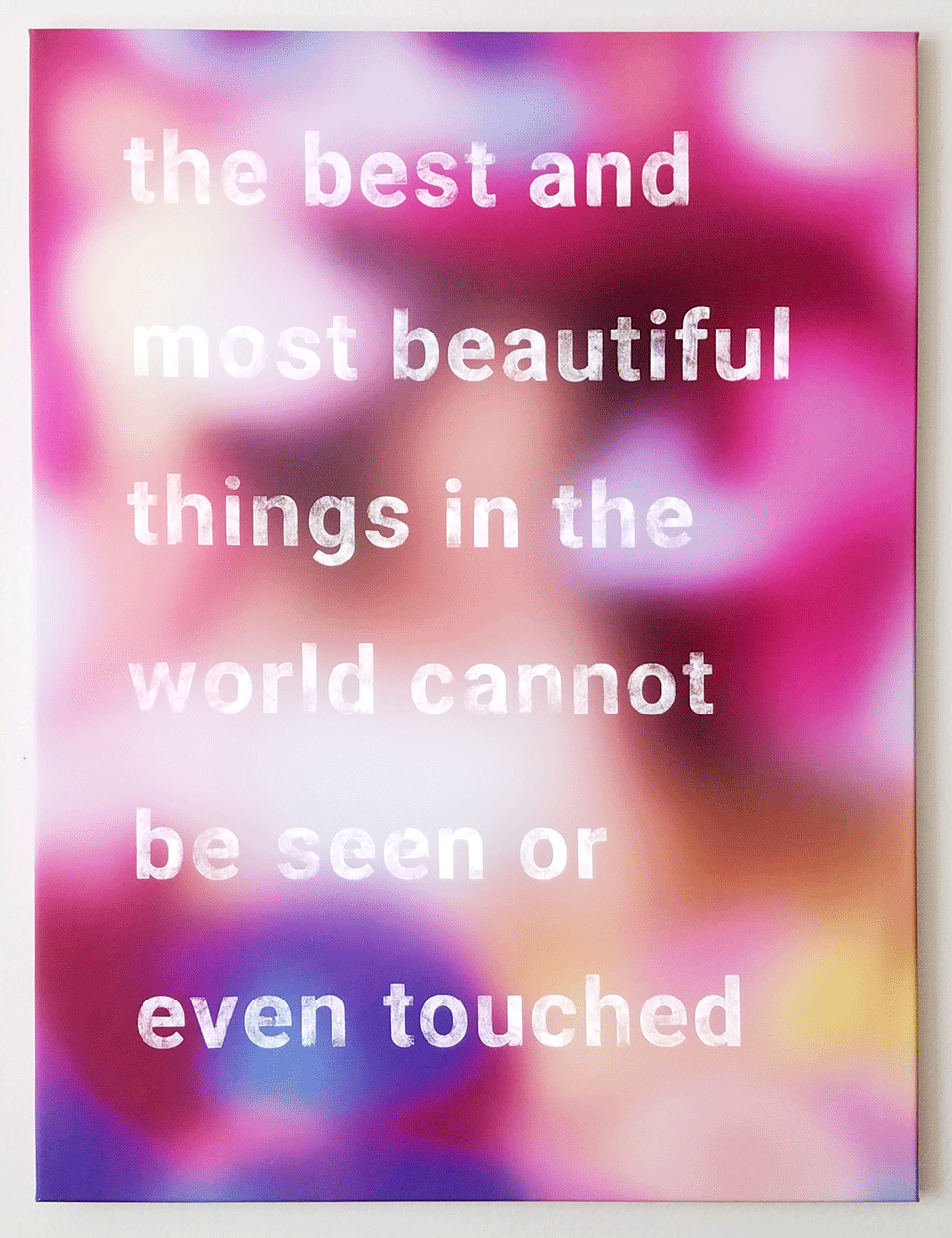 a multi-colored rectange with the text, "the best and most beautiful things in the world cannot be seen or even touched" that flashes on and off