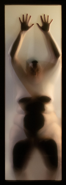 Photograph of a nude woman behind a paper screen in a hotel room by Kristine Schomaker