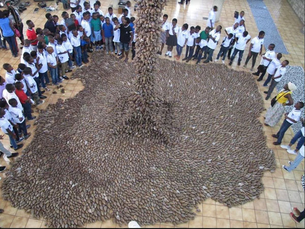 A photograph of a large sculpture installation by Livingstone Amoako made of thousands of Snail Shells