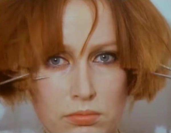 Screen shot from Rebecca Horn's Cutting Hair and Oasis movie from 1974-75