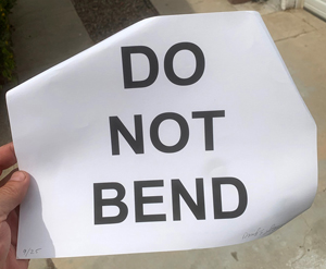 Picture of David E. Stone's DO NOT BEND print after having been mailed