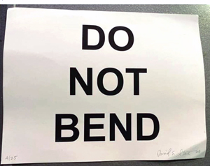 Picture of David E. Stone's DO NOT BEND print after having been mailed